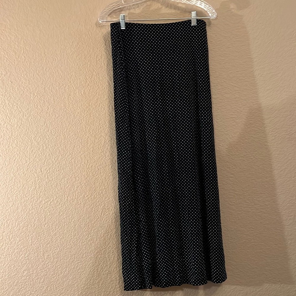 Black maxi skirt with white polkadots and button detail in the front.